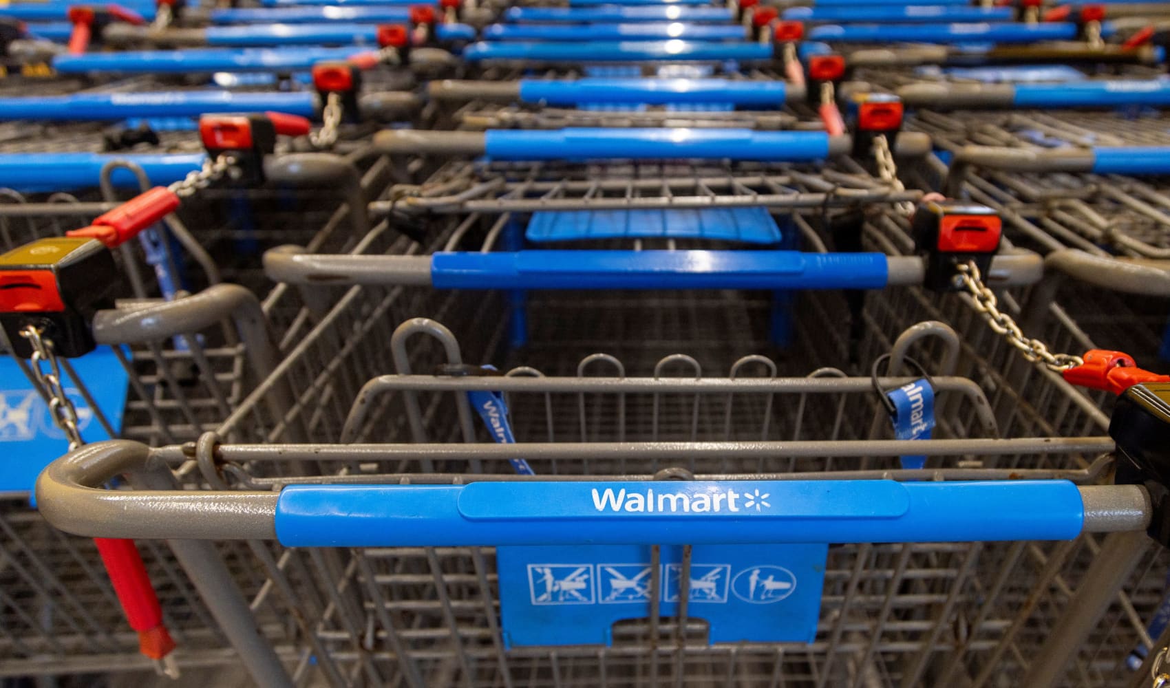 Shopping carts are lined up inside a Walmart store in Hamilton, Ontario, Canada, January 28, 2025. 