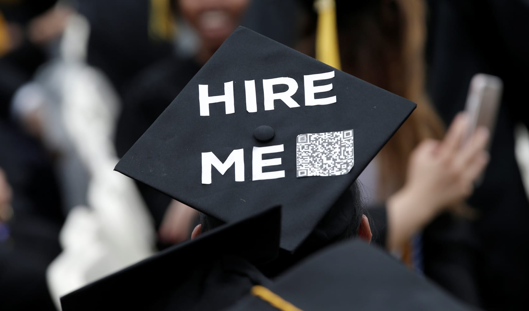 A graduating student of the CCNY wears a message on his cap during the College’s commencement ceremony.